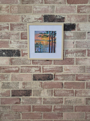 Linger by Dawn Babcock shown at a distance on a brick wall, giving a sense of the framed scale